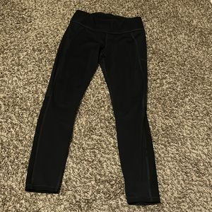 black athletic leggings. mesh on back of calves.